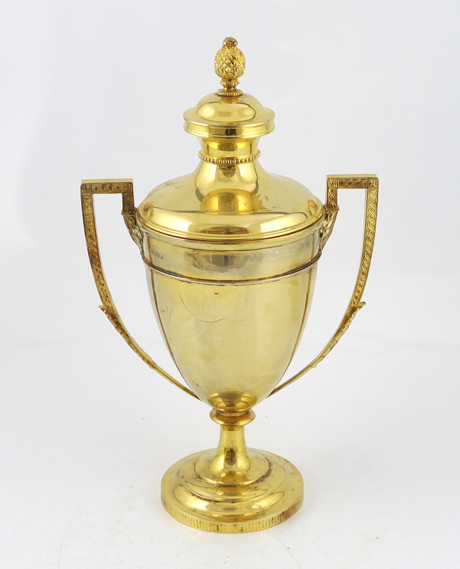 A late Victorian silver gilt two handled vase shaped presentation trophy cup